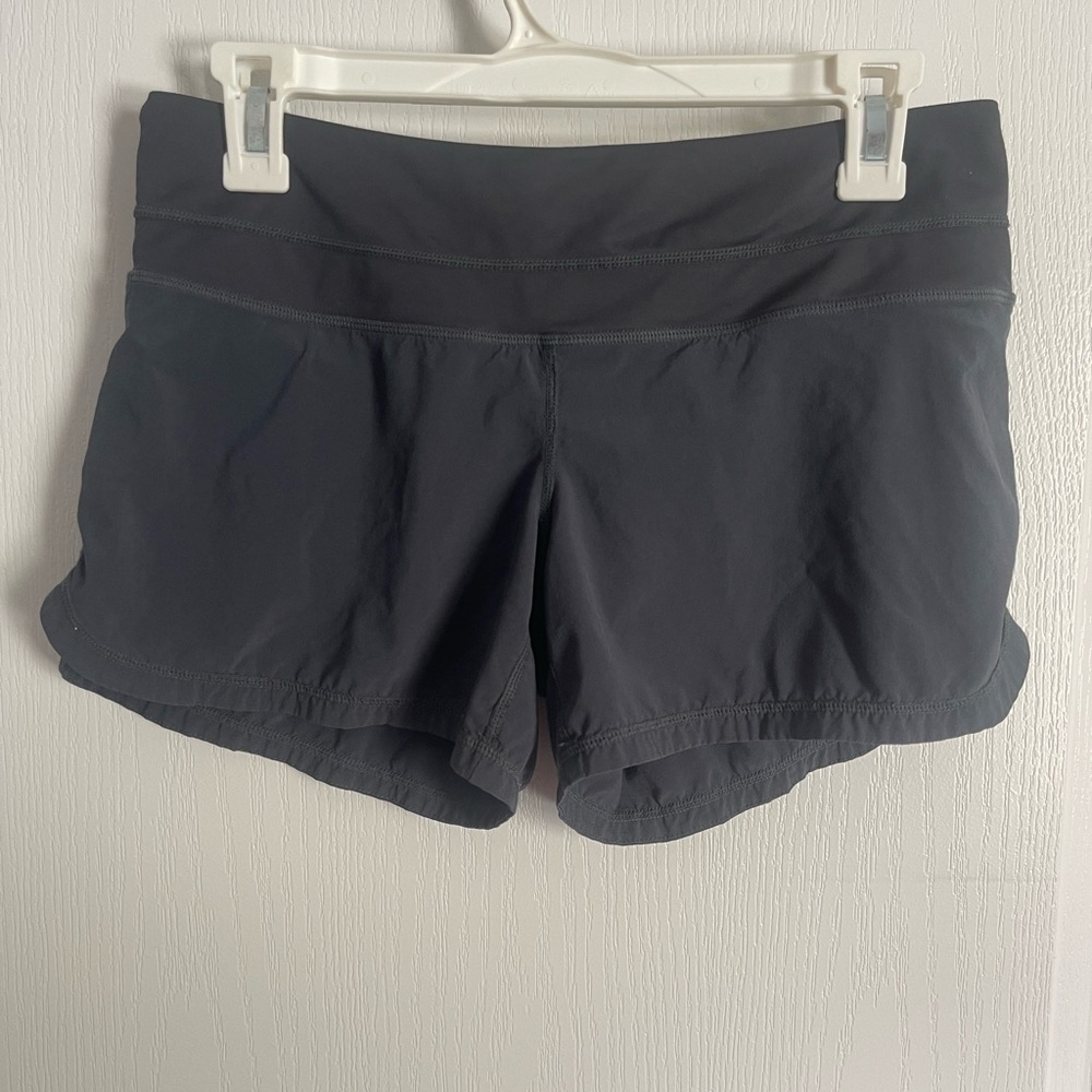 Lululemon Black Athletic Shorts with Wide Waistband and Curved Hem